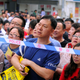 Parents wait behind police cordon outside the venue for the annual national college entrance examination, or "gaokao", in Shenyang, Liaoning province, China June 7, 2018.